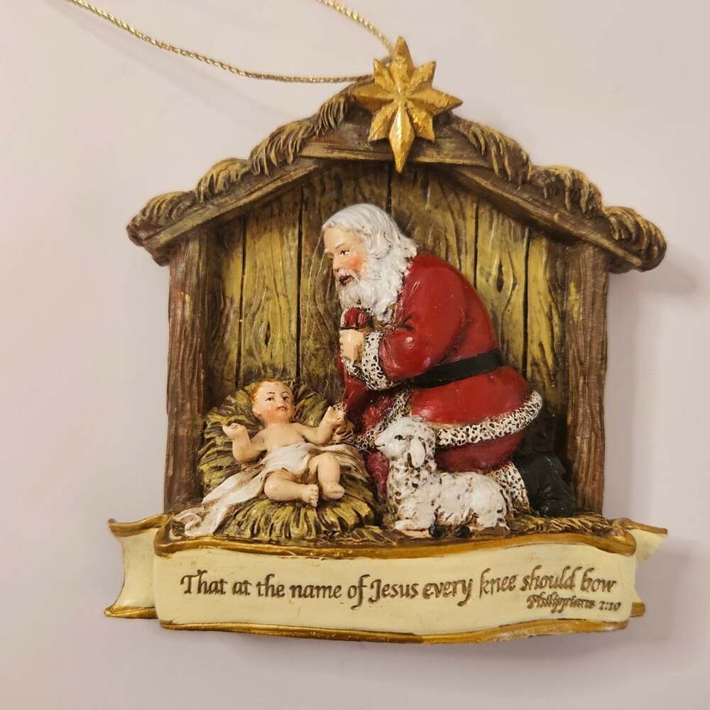 Roman Kneeling Santa Nativity Baby Jesus Christmas Ornament Philippians 2:10